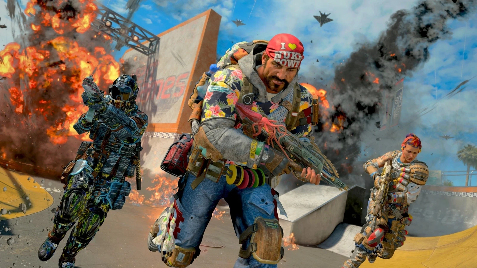 Three Call of Duty operators, one in an 'I love Nuketown' bandana, run amid explosions on the Nuketown map.
