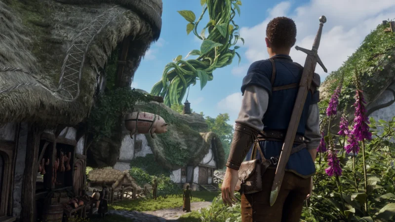 A swordsman looks toward a giant beanstalk over a thatched-roof village in Fable's world of Albion.
