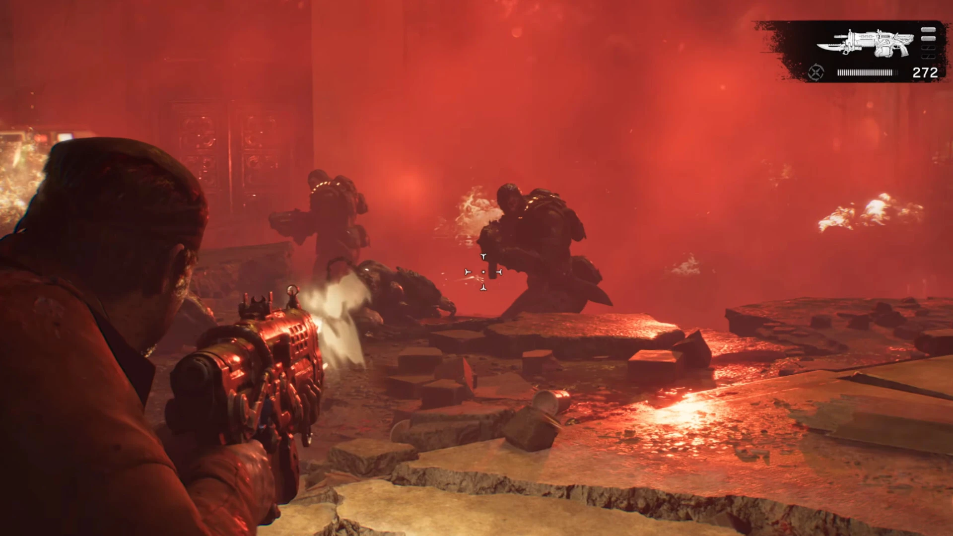 An over-the-shoulder Gears of War: E-Day gameplay scene with soldiers firing amid red haze.