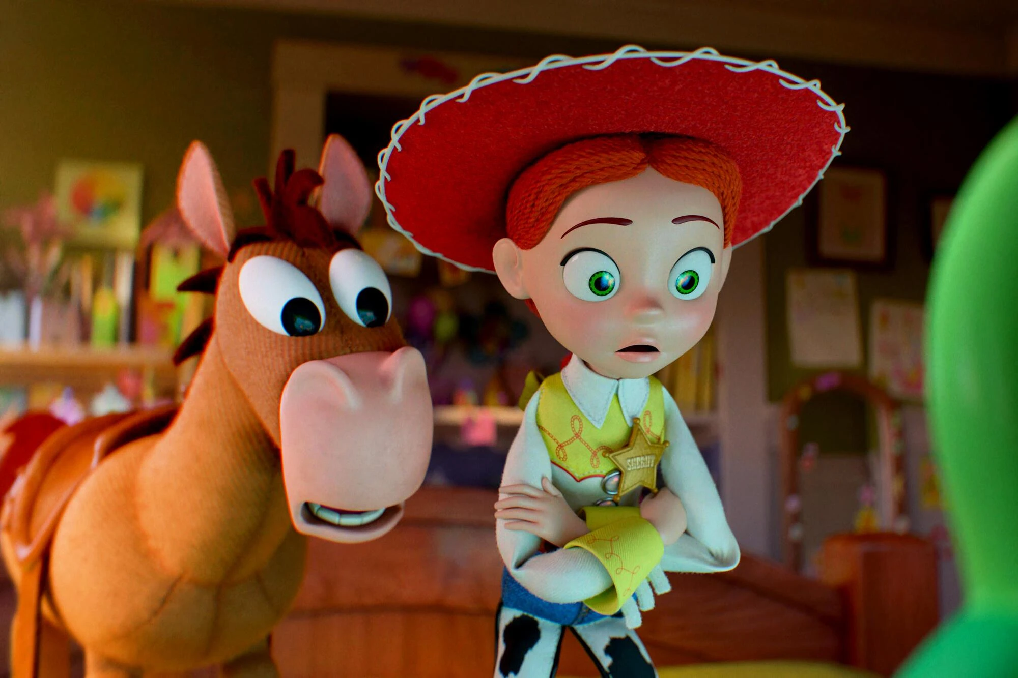 The cowgirl doll Jessie stands with her arms crossed beside the horse Bullseye in a child's room in Toy Story 5.